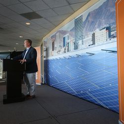 FILE -- Vivint Solar CEO David Bywater speaks at a press conference concerning the new rooftop solar installation at Vivint Smart Home Arena in Salt Lake City on Wednesday, Oct. 26, 2016. More than 2,500 solar panels have been installed atop the home of the Utah Jazz, forming one of the largest rooftop solar energy systems among indoor sports venues in the U.S.