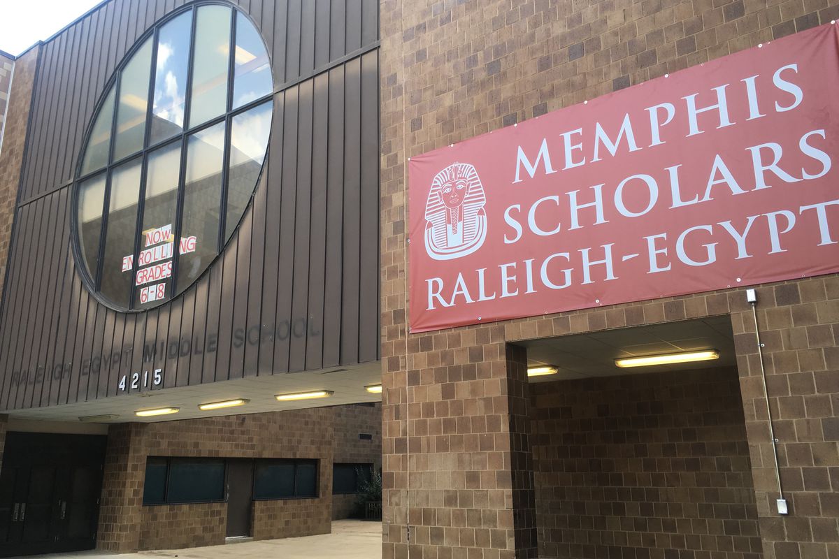 The new sign for Memphis Scholars Raleigh-Egypt is hung near the faded letters of the school’s former middle school name under Shelby County Schools.