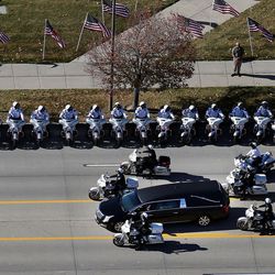 The funeral procession for West Valley police officer Cody Brotherson leaves the Maverik Center in West Valley City on Monday, Nov. 14, 2016. Officer Brotherson was killed while trying to help stop a fleeing car during a chase on Nov. 6, 2016.