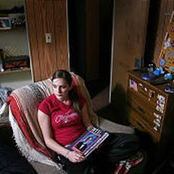 Crista Eggett sits in the room of her brother, Blake, a talented Riverton High School flute player who committed suicide Oct. 28, 2005.