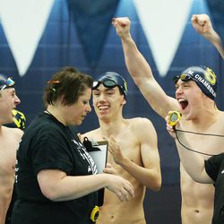 Skyline swimmers celebrate their win in the 200-yard freestyle relay during 4A State swim meet in Provo Saturday, Feb. 14, 2015. 