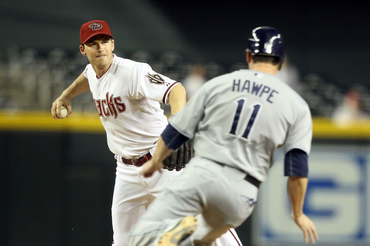 Stephen Drew ponders that eternal question- complete the double play, or hit Brad Hawpe in the face?