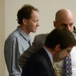 John Brickman Wall, 51, stands at the defense table during a recess in 3rd District Court Wednesday, Feb. 18, 2015, in Salt Lake City at the beginning a four-week trial. He's accused of killing his former wife, Uta von Schwedler, in 2011. 
