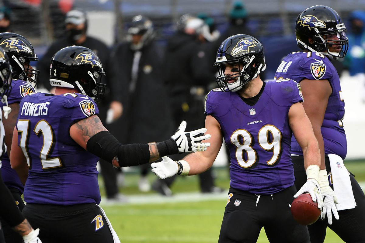 Tight end Mark Andrews #89 of the Baltimore Ravens celebrates with teammate guard Ben Powers #72 following a touchdown reception during the fourth quarter of their game against the Jacksonville Jaguars at M&amp;T Bank Stadium on December 20, 2020 in Baltimore, Maryland.