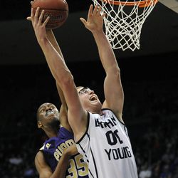 BYU forward Eric Mika (00) is fouled by Prairie View A&M Panthers center Reggis Onwukamuche (35) going to the basket during a game at the Marriott Center in Provo on Wednesday, Dec. 11, 2013.
