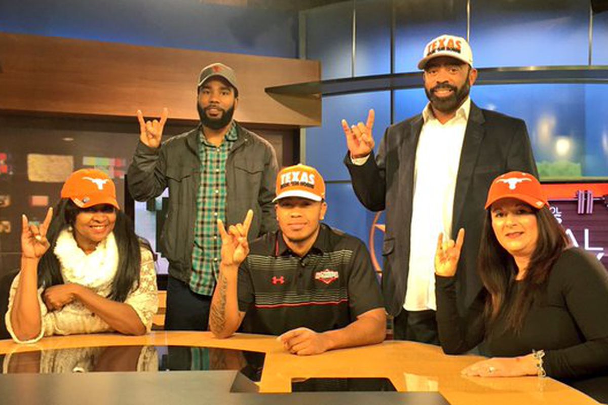 Eric Cuffee and his family after committing
