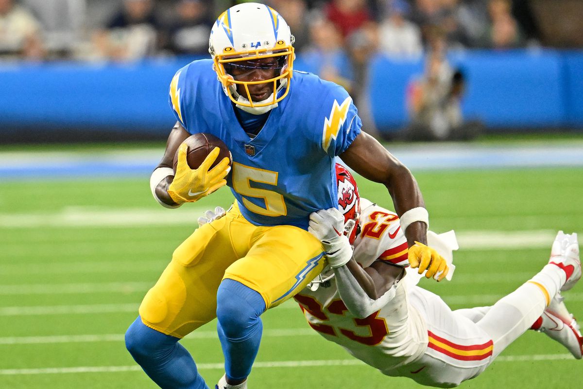 Kansas City Chiefs running back Ronald Jones (2) dives to make a tackle on Los Angeles Chargers wide receiver Joshua Palmer (5) during the second quarter at SoFi Stadium.&nbsp;