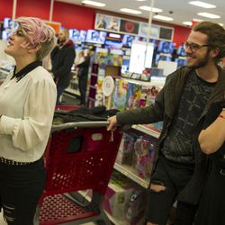 Natalie Hougaard looks for the right toy for her daughter with her friends Jade Roser and Allie Gee while doing last-minute shopping at Target in Salt Lake City on Friday, Dec. 23, 2016.