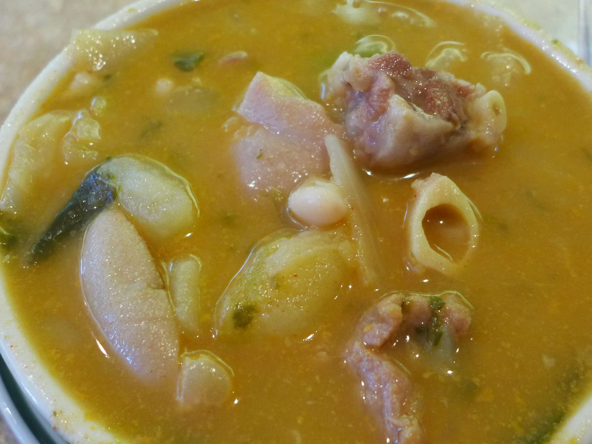 A soup of white beans, ham, and pig feet.