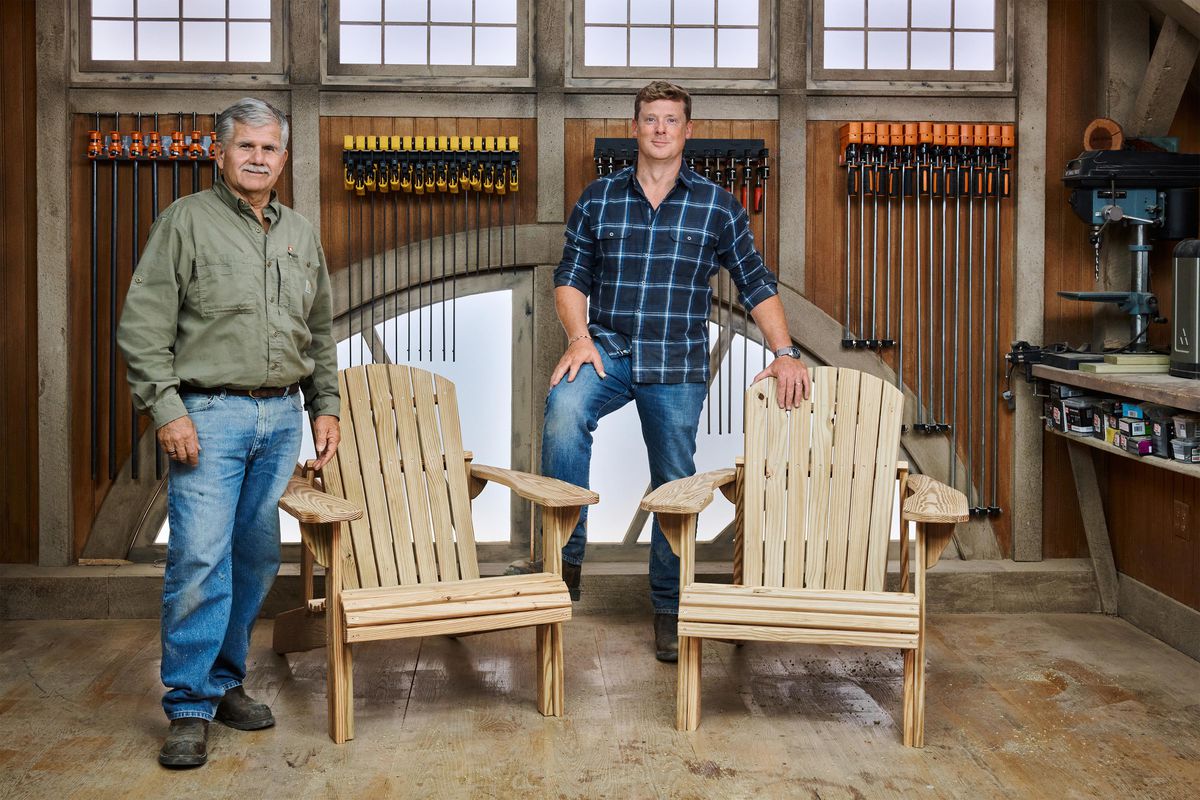 Kevin O’Connor and Tom Silva stand next to two Adirondack chairs they made for ASK This Old House.