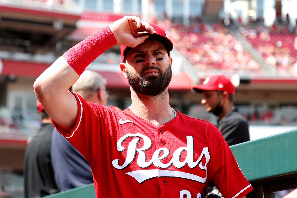 Jesse Winker #33 of the Cincinnati Reds stands in the dugout prior to the start of the game against the Colorado Rockies at Great American Ball Park on June 12, 2021 in Cincinnati, Ohio.