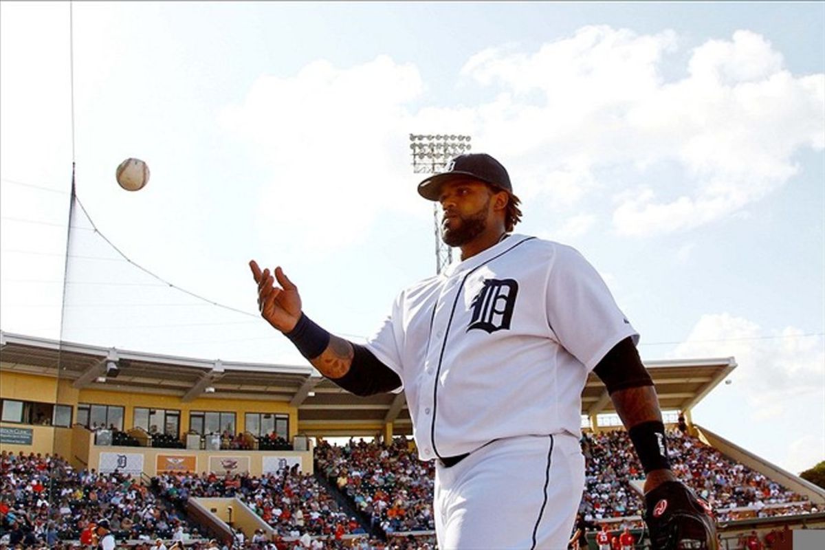 Detroit Tigers first baseman Prince Fielder (28) throws a ball to a fan in the stands following the end of the top of the eighth inning of a spring training game against the Washington Nationals at Joker Marchant Stadium. Awwwww.