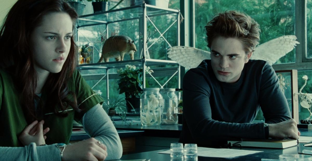 Edward Cullen (Robert Pattinson) scowls at Bella Swan (Kirsten Stewart) in Twilight.