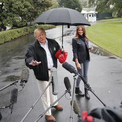 President Donald Trump and first lady Melania Trump walk across the South Lawn of the White House in Washington, Monday, Oct. 15, 2018, to board Marine One helicopter for a short trip to Andrews Air Force Base, Md., en route to Florida to tour areas the devastation left behind from Hurricane Michael last week. (AP Photo/Pablo Martinez Monsivais)