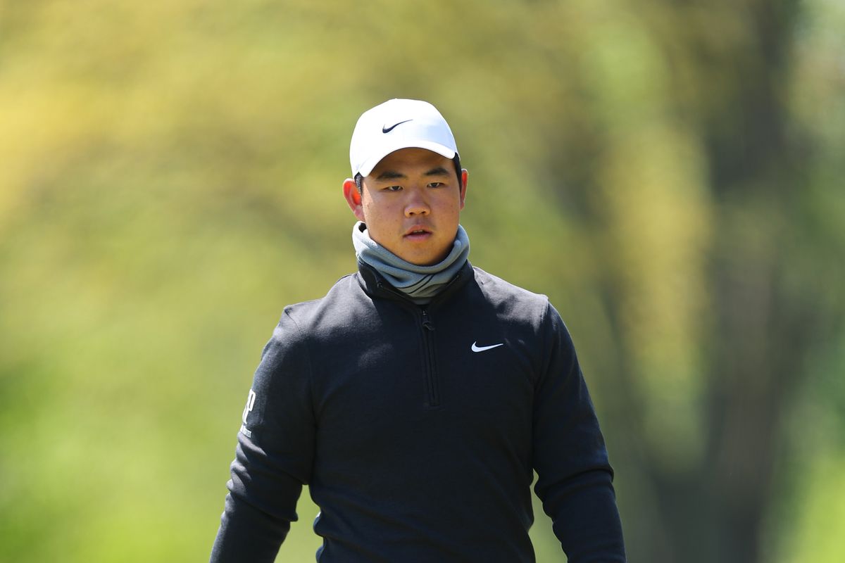 Tom Kim of South Korea walks the fifth hole during a practice round prior to the 2023 PGA Championship at Oak Hill Country Club on May 17, 2023 in Rochester, New York.