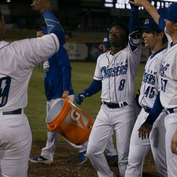 High fives all around for DJ Burt (#8), the walkoff hero. For the record, the game would end in a tie rather than go to extra innings if Omaha had not scored in the 9th.