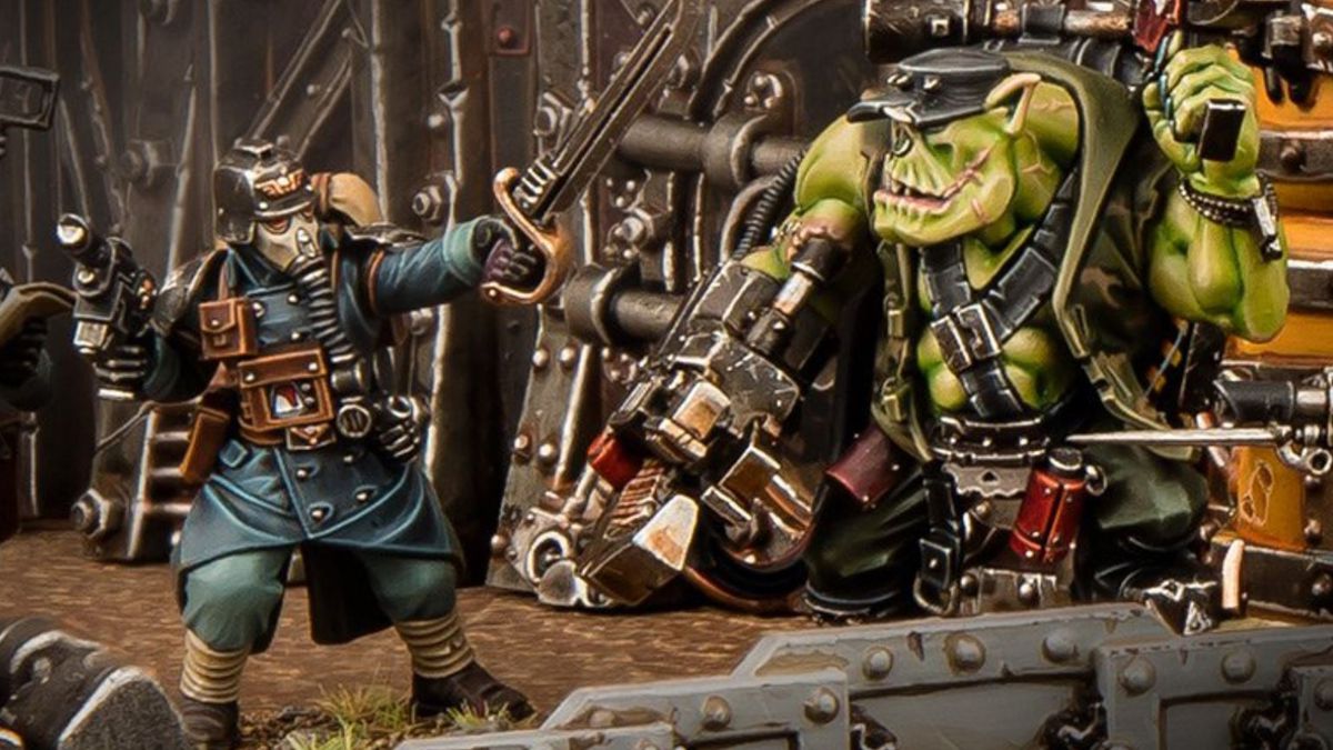 A Krieg sergeant in blue squares off against a hulking Ork with a mechanical arm.