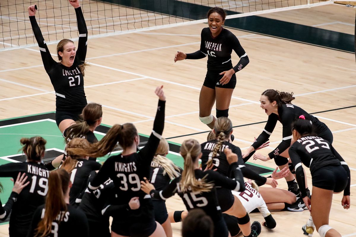 Lone Peak celebrates its win over Copper Hills in the 6A volleyball championship match at Hillcrest High School in Midvale on Saturday, Nov. 7, 2020.