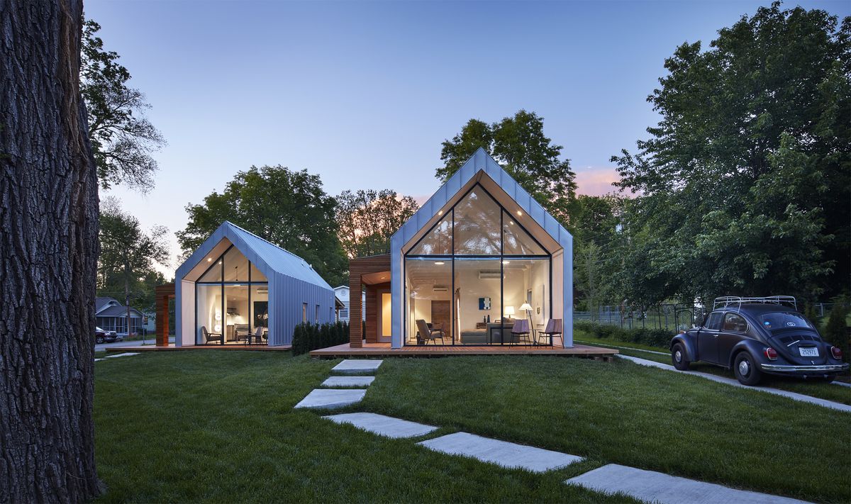 Two houses with A-frame windows in front.