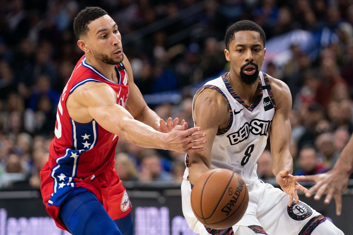 Brooklyn Nets guard Spencer Dinwiddie passes the ball past Philadelphia 76ers guard Ben Simmons during the fourth quarter at Wells Fargo Center.