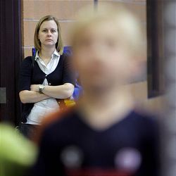 Leeann Whiffen watches Clay, her son, do gymnastics. Whiffen credits early intervention with helping her son. A study of adult Utahns with autism may offer parents hope. 