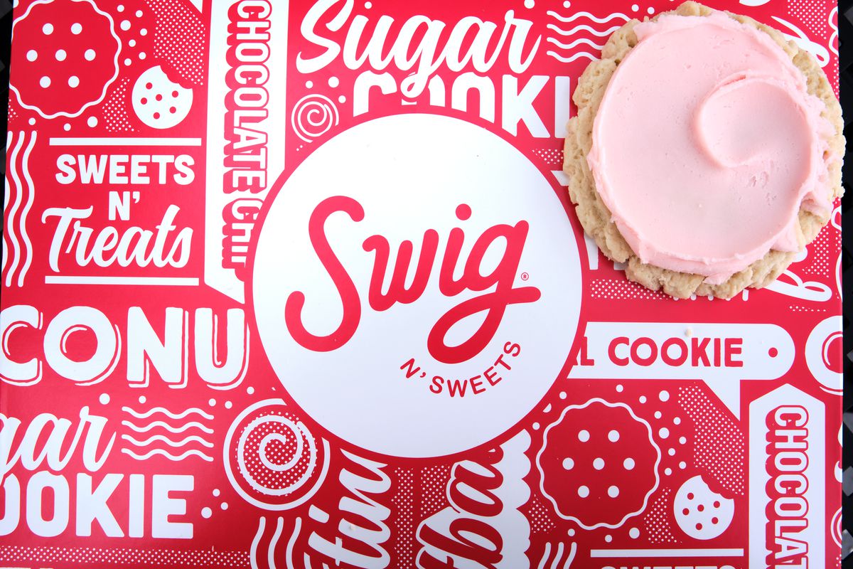 a Swig logo on a box with a cookie. 