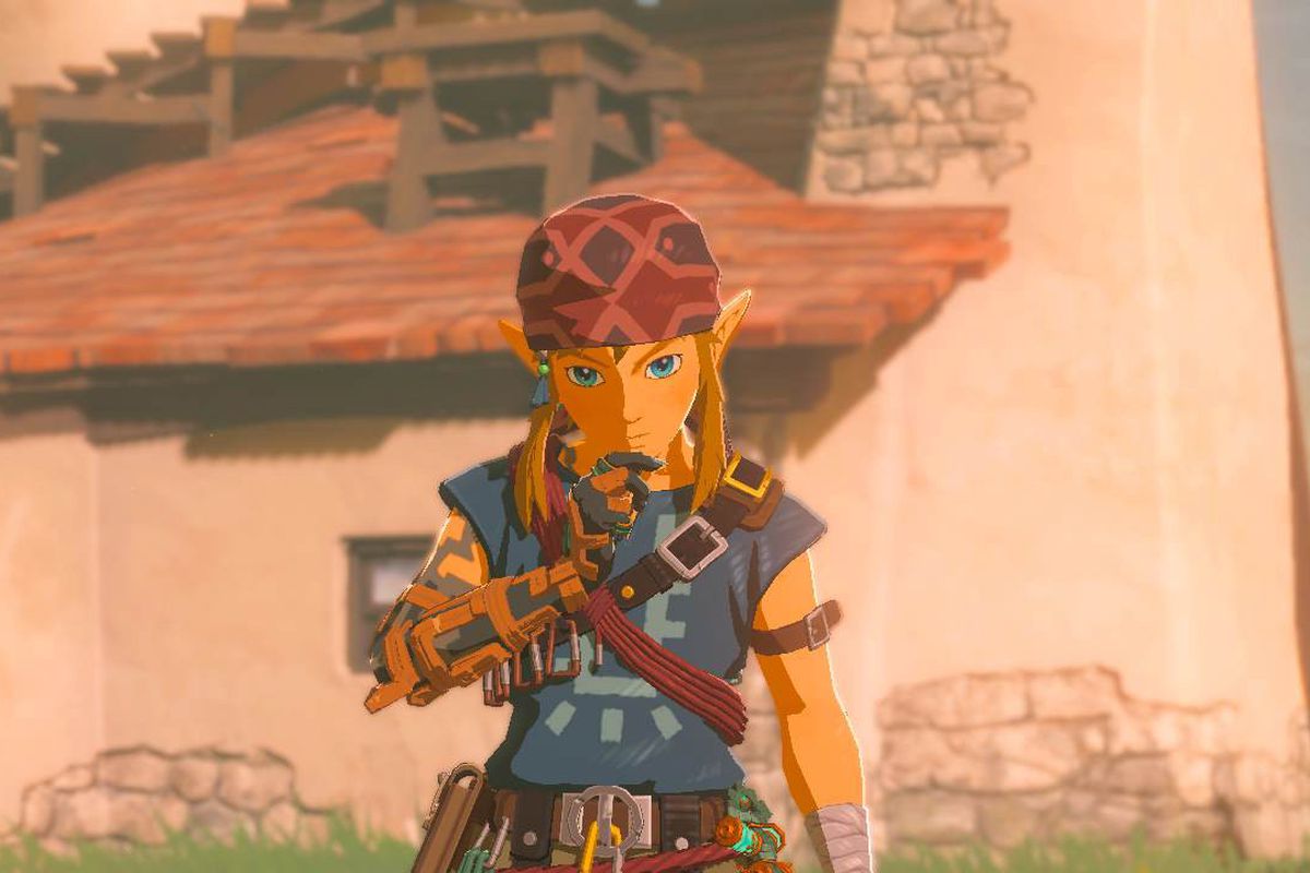 Link stands lost in thought in front of the camera while wearing the Climbing Armor set in Zelda: Tears of the Kingdom