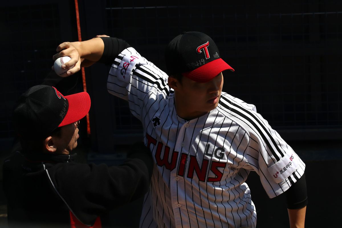 Letters reading “Corona 19 Out” are seen on the cap of LG Twins baseball team’s pitcher Lim Chan-gyu ahead of their intra-team game to be broadcasted online for their fans at a empty Jamshil baseball stadium as South Koreans take measures to protect themselves against the spread of coronavirus (COVID-19) on April 05, 2020 in Seoul, South Korea.