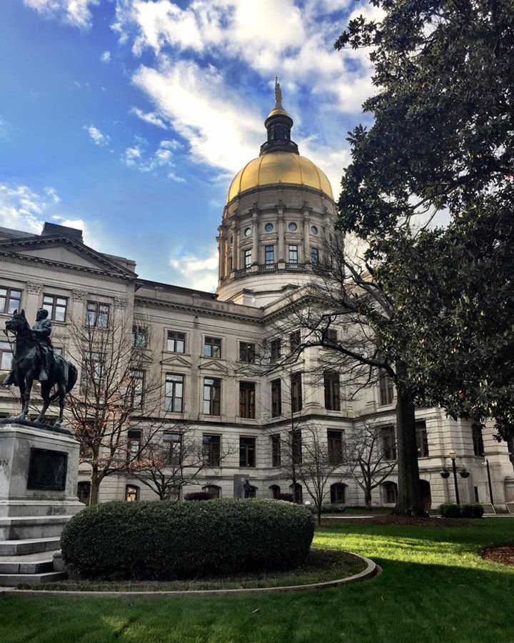 An exterior photo of the Georgia Capitol Building with its gold dome.
