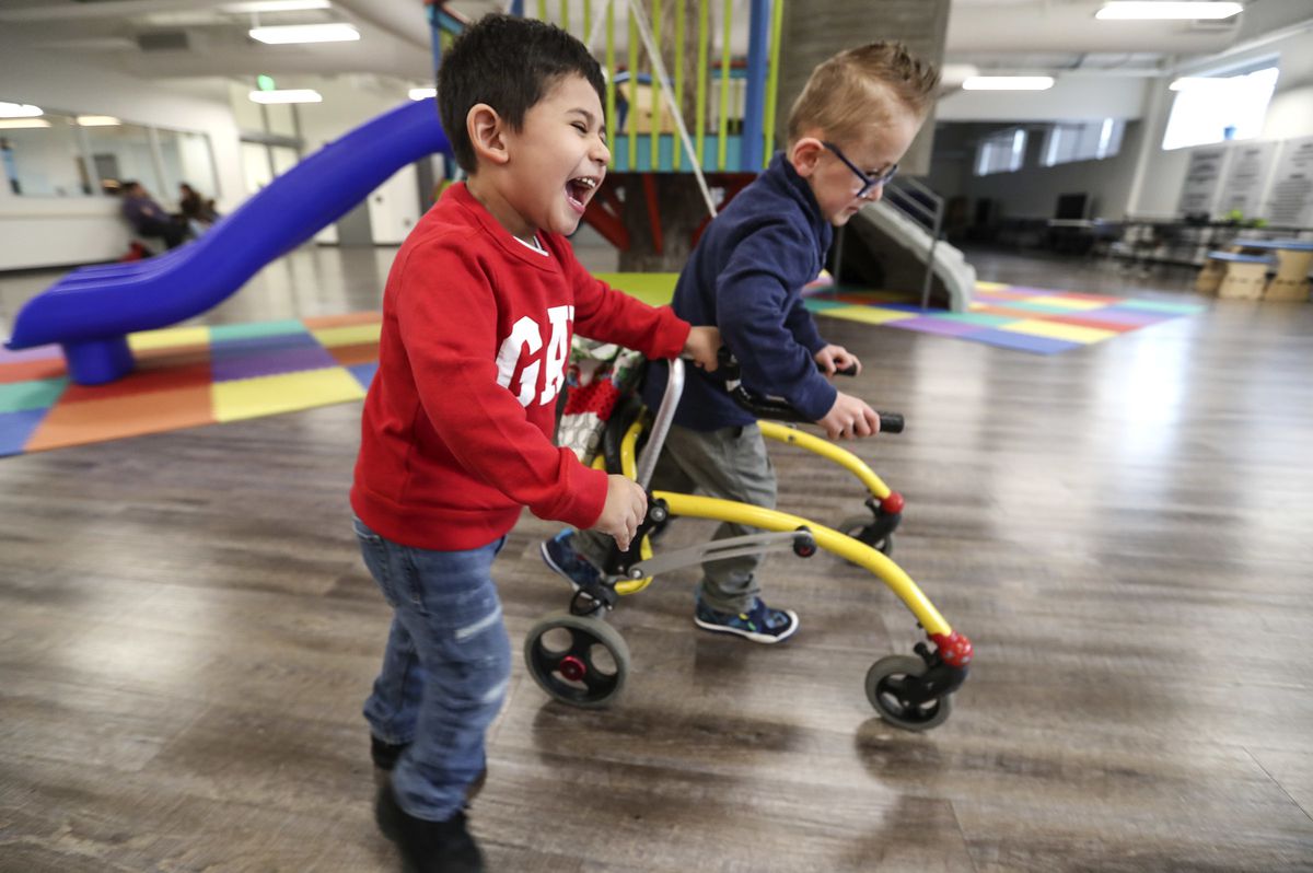Elijah Sotelo, 3, left, and at Owen Butler, 6, play during physical therapy at Neuroworx, in Sandy on Friday March 8, 2019. Elijah has been attending therapy at Neuroworx since 2016 after a head injury caused the left side of his brain to stroke, leaving 