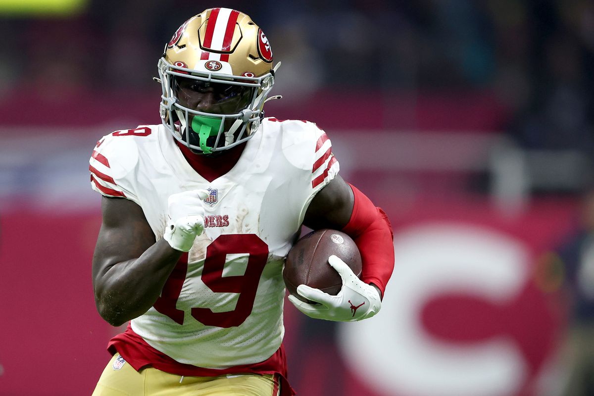 Deebo Samuel #19 of the San Francisco 49ers carries the ball against the Arizona Cardinals during the third quarter at Estadio Azteca on November 21, 2022 in Mexico City, Mexico.