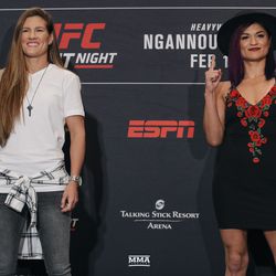 Cortney Casey and Cynthia Calvillo pose on stage Friday at UFC Phoenix media day.