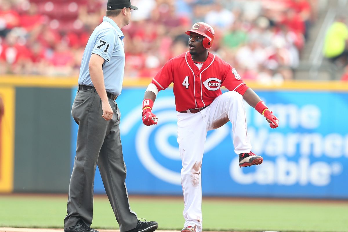 Brandon Phillips teaches umpire Jordan Baker how to do the wobble.  (If you are going to attend any weddings in the next decade, you may as well start learning this dance now.)