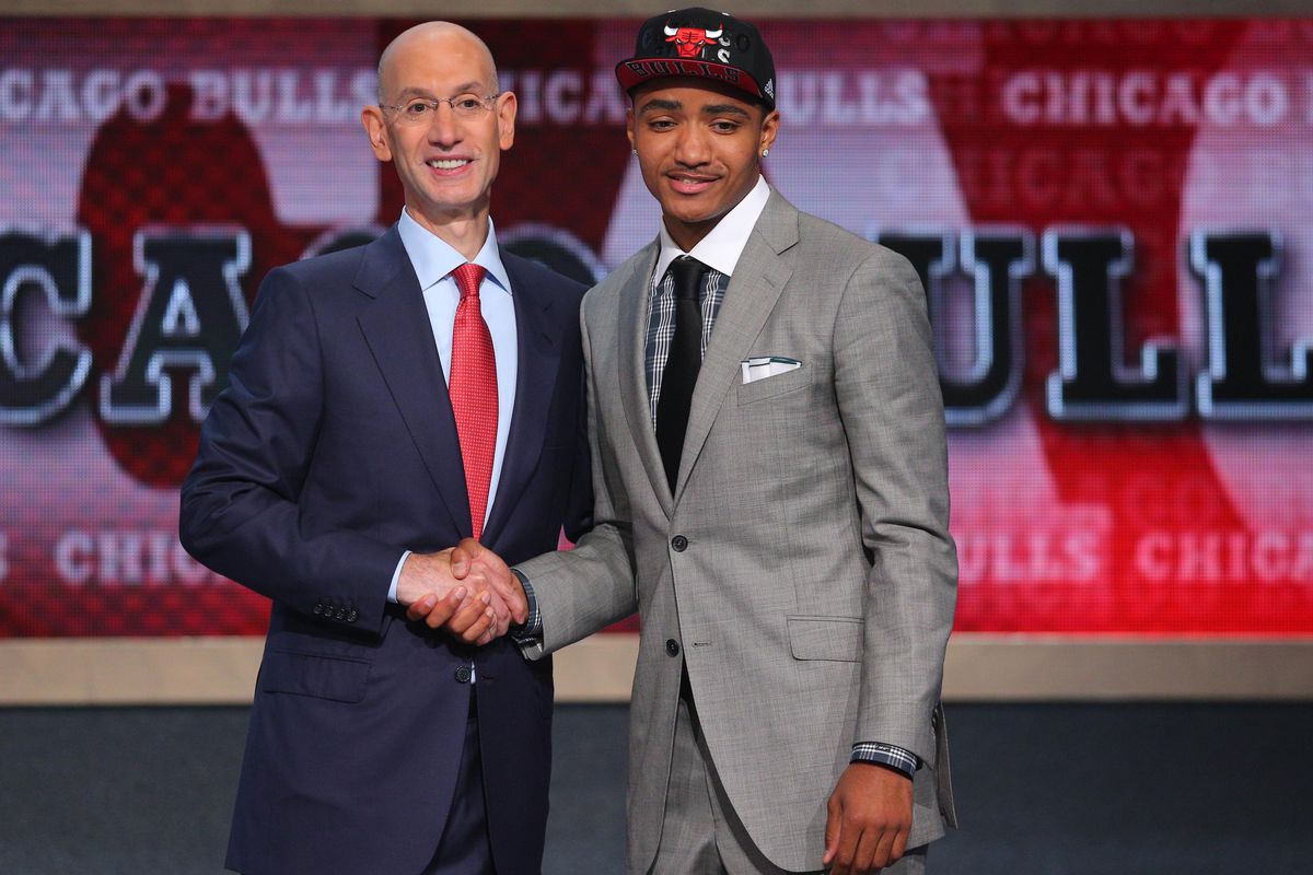 NBA commish Adam Silver and Nuggets guard Gary Harris doing the draft formalities. 
