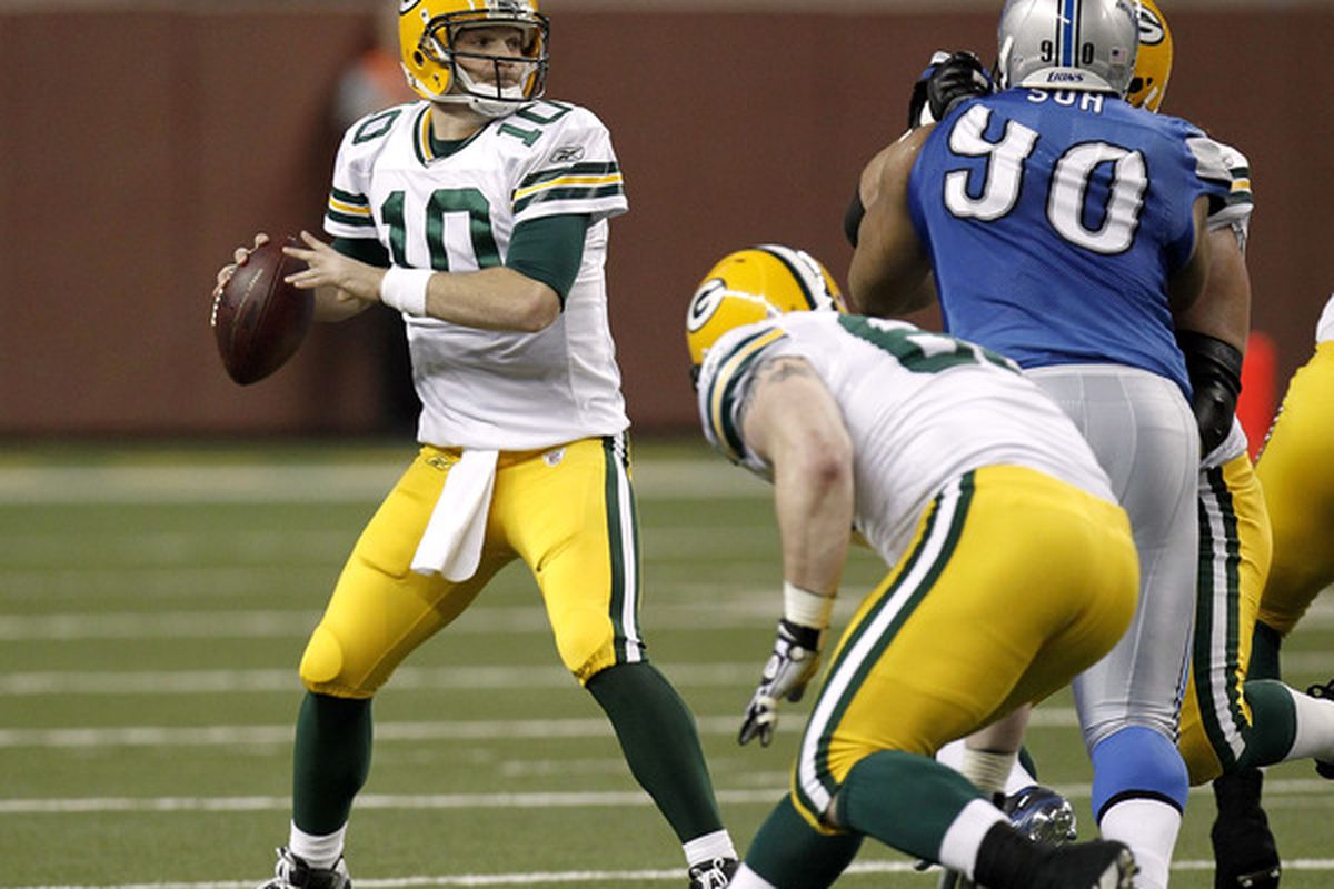 DETROIT MI - DECEMBER 12: Matt Flynn #10 of the Green Bay Packers looks to throw a second quarter pass behind Ndamukong Suh #90 of the Detroit Lions on December 12 2010 at Ford Field in Detroit Michigan.  (Photo by Gregory Shamus/Getty Images)