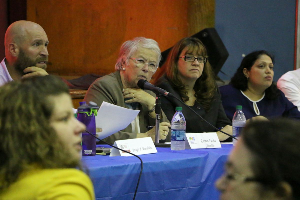 Chancellor Fariña spoke about school diversity at a town hall in District 3 in 2015. She is seated next to Superintendent Ilene Altschul, second from right.