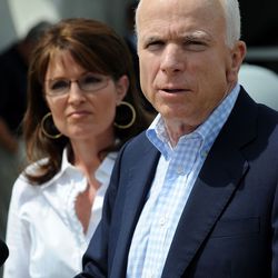 Sarah Palin listens as McCain speaks for an update on the situation regarding Hurricane Gustav.