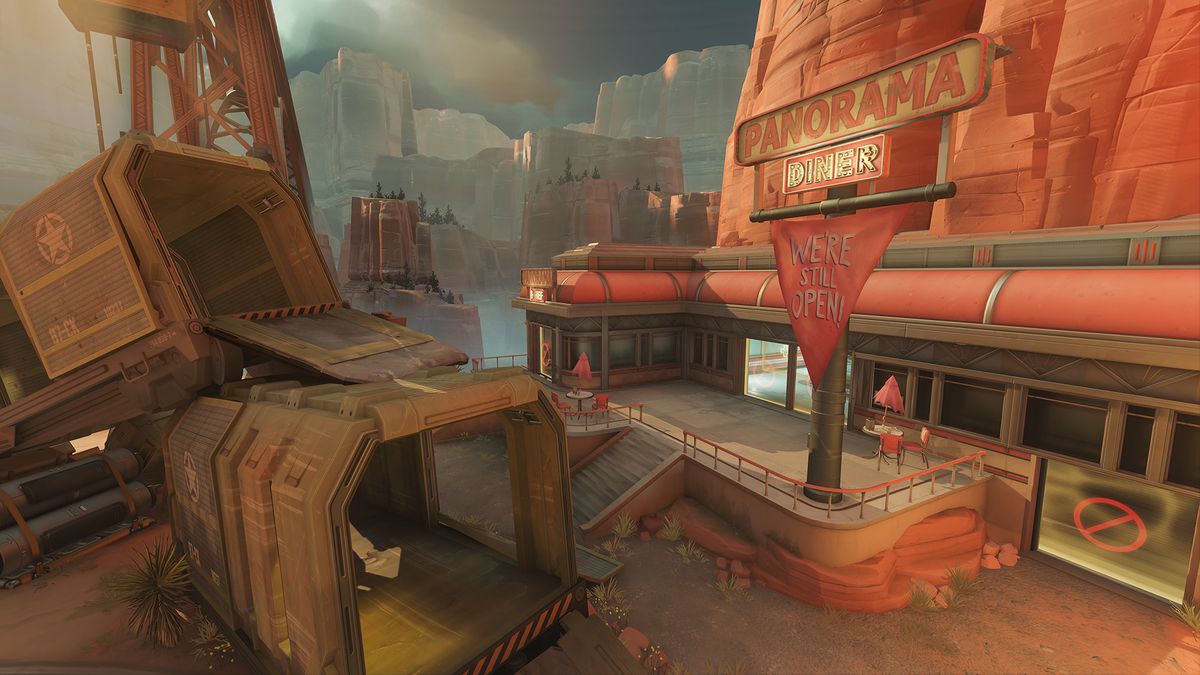 A shot of the Panorama Diner entrance on Overwatch 2’s Route 66 map, showcasing the new sign that provides cover for the center doors