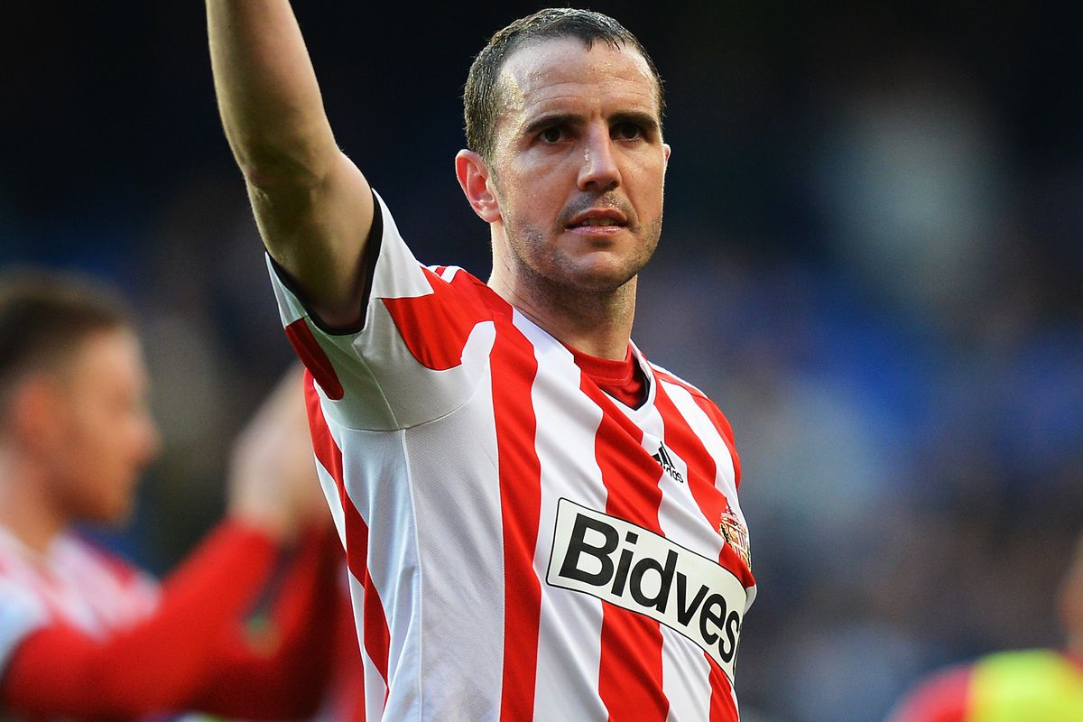 John O'Shea salutes fans after Sunderland's win at Chelsea in April