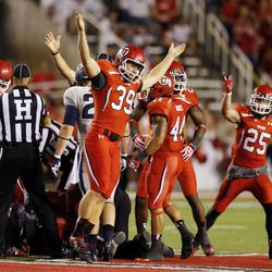 Andy Phillips (39) of the Utah Utes celebrates after his team recovers an on side kick against Utah State during NCAA football in Salt Lake City, Thursday, Aug. 29, 2013.