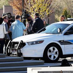 The car of West Valley City police officer Cody Brotherson, who was killed while trying to stop a fleeing car during a chase early Sunday morning, is on display as Police Chief Lee Russo talks with the media in West Valley City on Monday, Nov. 7, 2016.