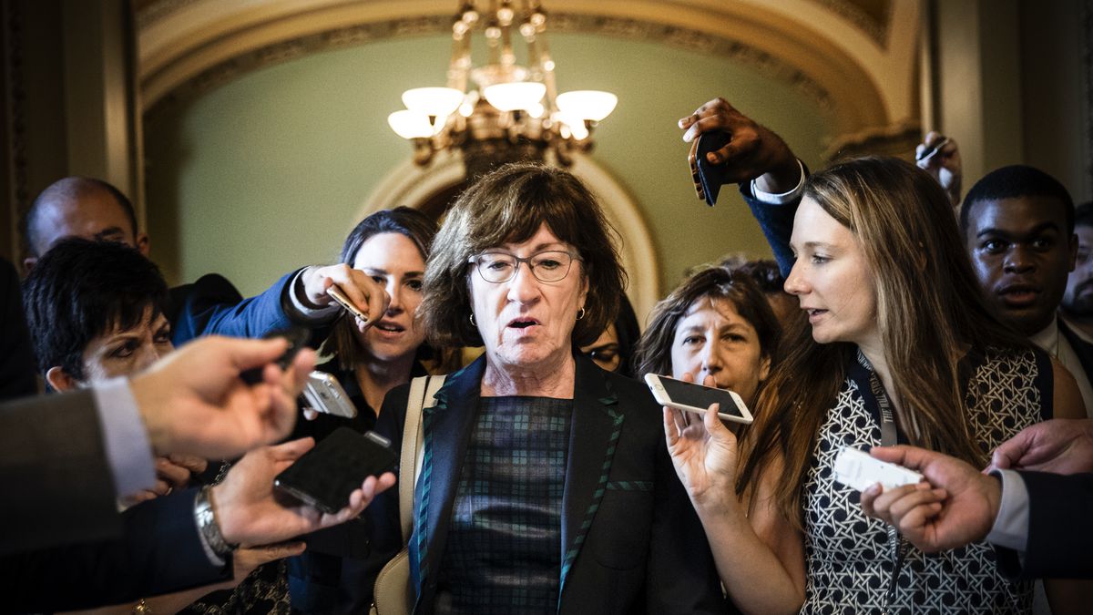 Sen. Susan Collins (R-ME) is surrounded by reporters following a closed-door meeting of Senate Republicans on September 26, 2018.