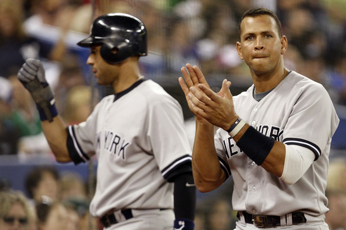 TORONTO - JUNE 6: Alex Rodriguez #19 and Derek Jeter #2 of the New York Yankees celebrate runs at the Rogers Centre against the Toronto Blue Jays June 6, 2010 in Toronto, Ontario, Canada. (Photo by Abelimages/Getty Images)