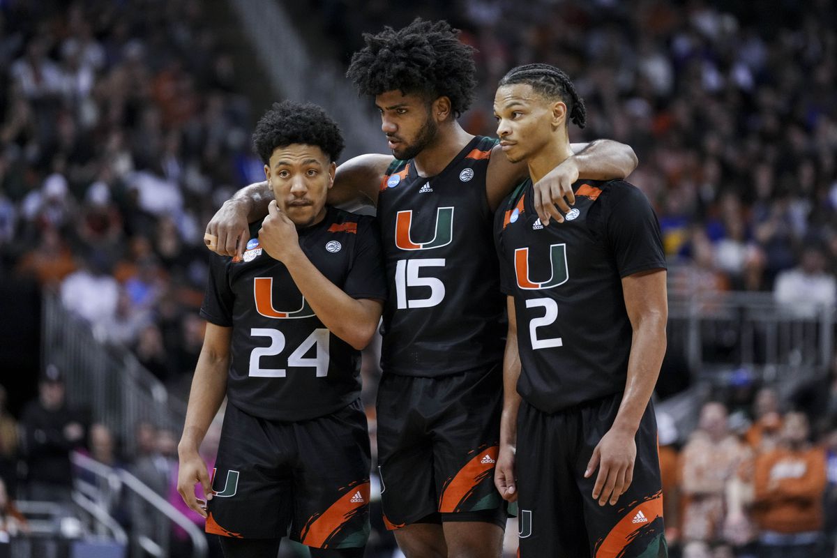 Miami Hurricanes guard Nijel Pack (24), forward Norchad Omier (15), and guard Isaiah Wong (2) stand on the court as guard Jordan Miller (11) shoots a free throw against the Texas Longhorns in the second half at the T-Mobile Center.&nbsp;