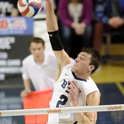 BYU's Carson Heninger (2) goes for a kill attempt during a match against the Stanford Cardinal Friday, Jan. 24, 2014, at the Smith Fieldhouse in Provo.