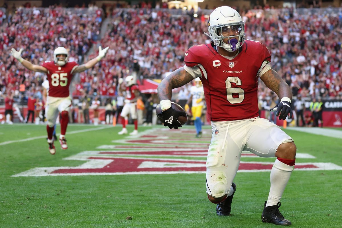 Running back James Conner #6 of the Arizona Cardinals reacts after scoring a six-yard touchdown reception against the Los Angeles Chargers during the NFL game at State Farm Stadium on November 27, 2022 in Glendale, Arizona. The Chargers defeated the Cardinals 25-24.