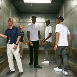 New Utah Jazz players Joel Bolomboy, center, Tyrone Wallace, second from right, and Marcus Paige, right, ride a freight elevator during a tour of Vivint Smart Home Arena after a press event introducing the new players in Salt Lake City on Wednesday, June 29, 2016.