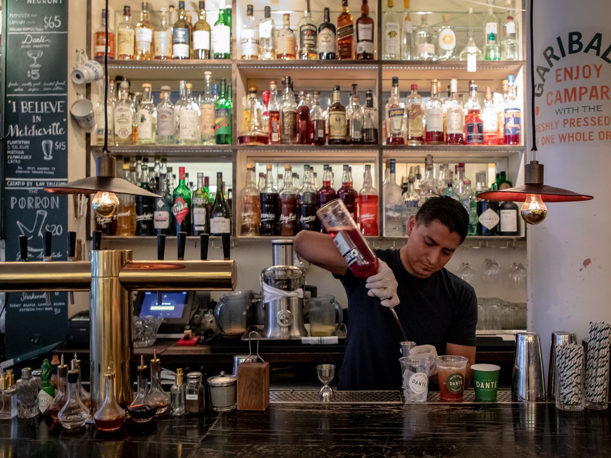 Dante bartender Eloy Mancheco prepares drinks for takeout