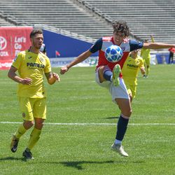 Johan Gomez (9) bringing a long ball down during the opening match of the 40th Annual Dallas Cup. 