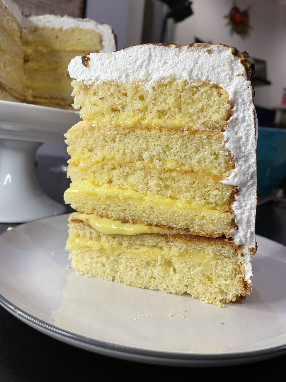 A slice of layered lemon cake. 